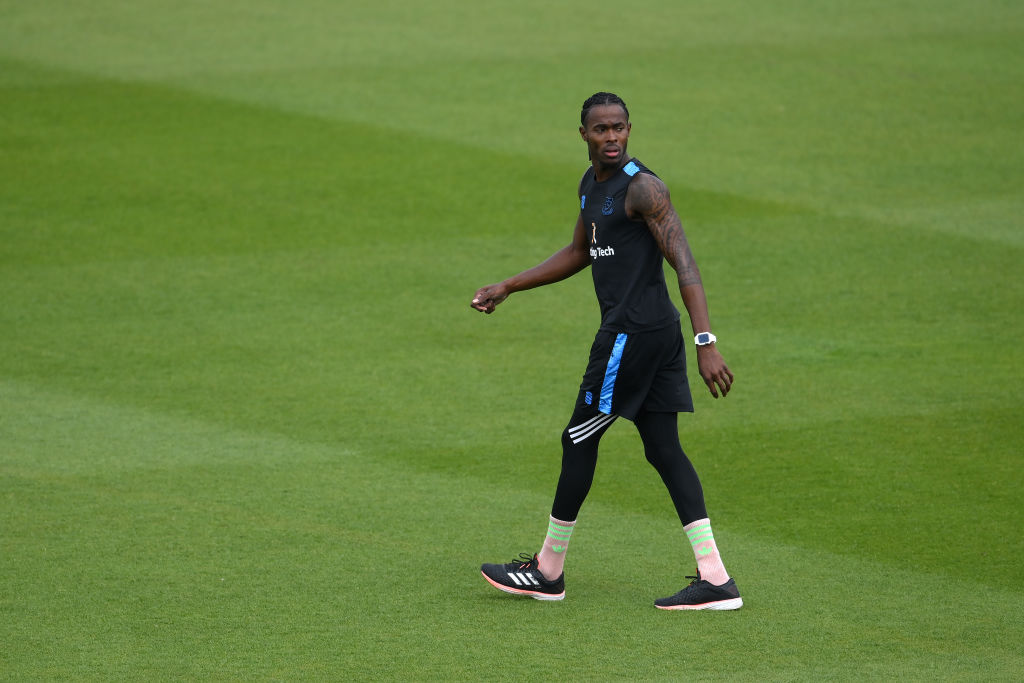 England pacer Jofra Archer walking on a cricket field