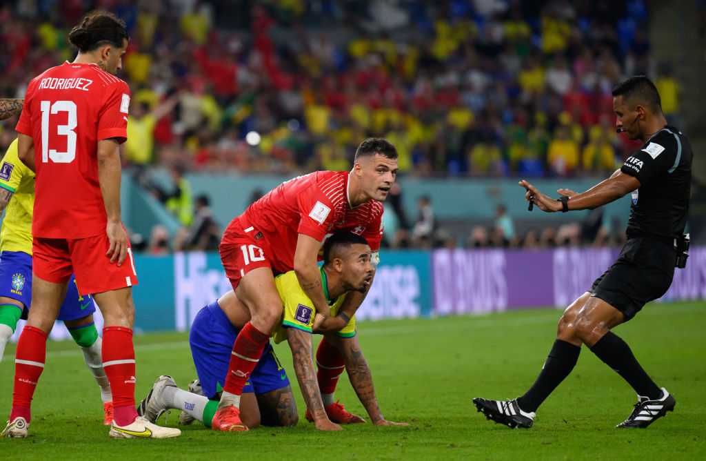 Arsenal pair Granit Xhaka (top) and Gabriel Jesus (in headlock) faced each other at the World Cup