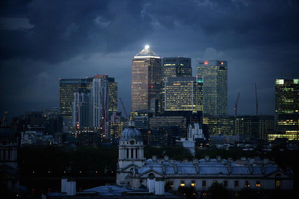 Clouds gather over high-rise buildings in the financial district of the Canary Wharf
 (Photo by Matt Cardy/Getty Images)