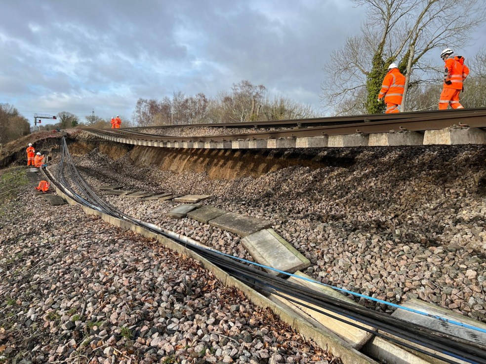 Network Rail image of a 44-metre landslip which happened on the embankment to the northeast of Hook station in Hampshire on the line from London to Basingstoke. Major disruption is expected as a main railway line has collapsed in a "huge" landslip which left one track hanging in mid-air.  