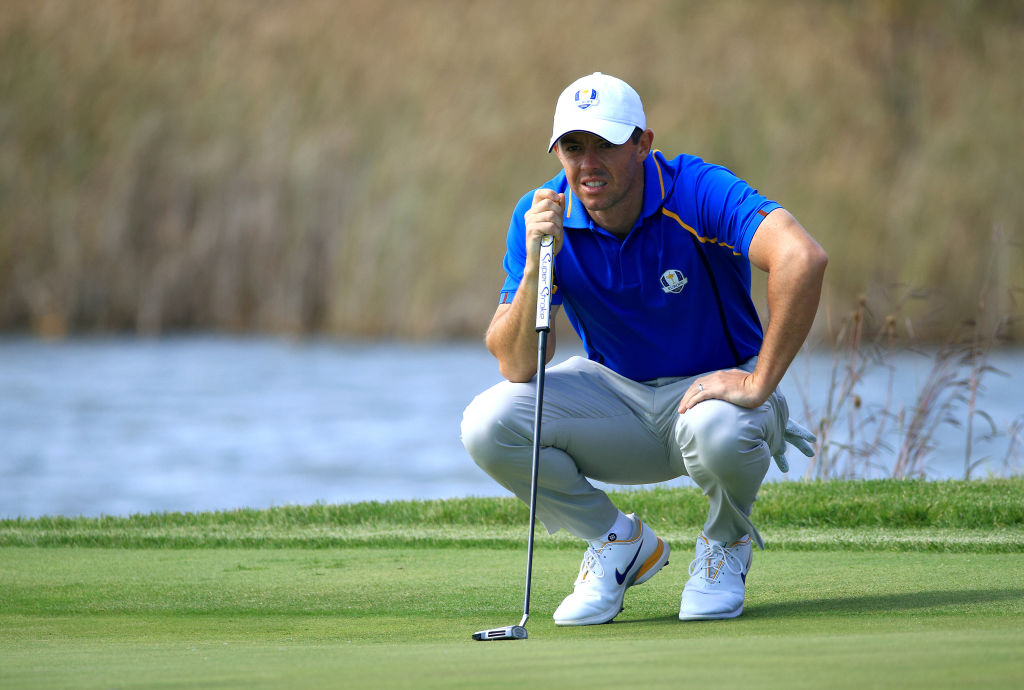 KOHLER, WISCONSIN - SEPTEMBER 24: Rory McIlroy of Northern Ireland and team Europe lines up a putt on the fifth green during Friday Afternoon Fourball Matches of the 43rd Ryder Cup at Whistling Straits on September 24, 2021 in Kohler, Wisconsin. (Photo by Mike Ehrmann/Getty Images)