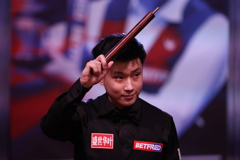 SHEFFIELD, ENGLAND - APRIL 21: Zhao Xintong of China enters the arena during the Betfred World Snooker Championship Round Two match between Stephen Maguire of Scotland and Zhao Xintong of China at Crucible Theatre on April 21, 2022 in Sheffield, England. (Photo by George Wood/Getty Images)