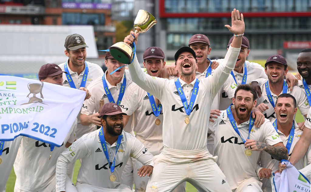 MANCHESTER, ENGLAND - SEPTEMBER 28: Surrey captain Rory Burns (with trophy) leads the celebrations after Surrey win the First Division Title after the third day of the LV= Insurance County Championship match between Lancashire and Surrey at Emirates Old Trafford on September 28, 2022 in Manchester, England. (Photo by Stu Forster/Getty Images)