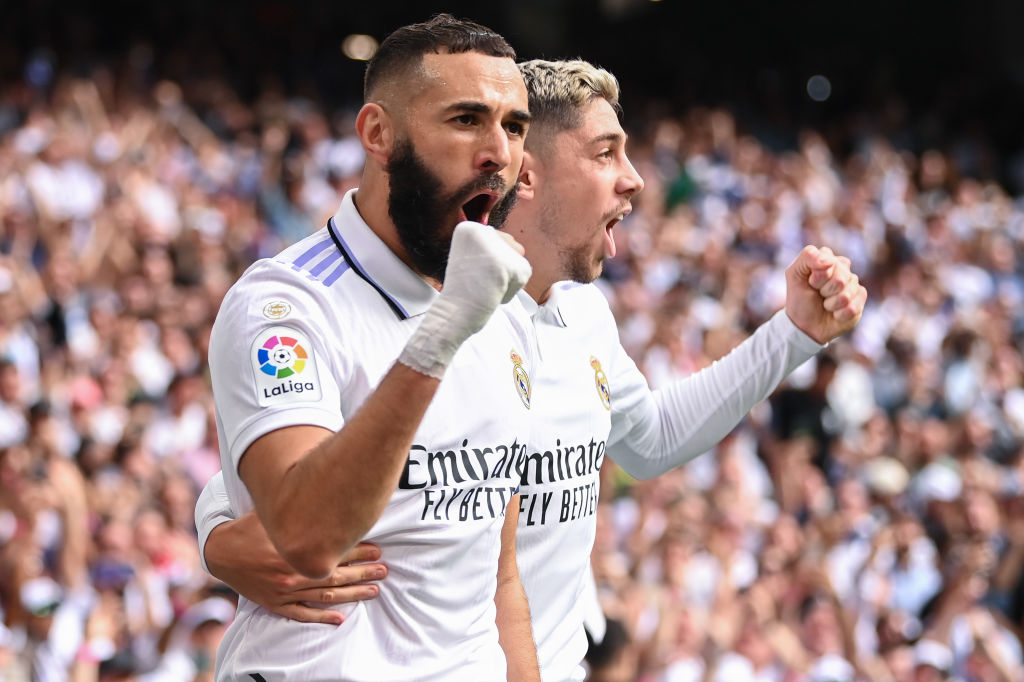 MADRID, SPAIN - OCTOBER 16: Karim Benzema celebrates with his team mate Federico Valverde of Real Madrid CF after scoring his team's first goal during the LaLiga Santander match between Real Madrid CF and FC Barcelona at Estadio Santiago Bernabeu on October 16, 2022 in Madrid, Spain. (Photo by David Ramos/Getty Images)