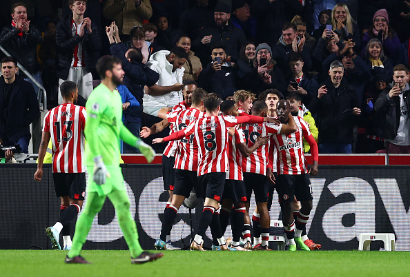 Brentford celebrate one of their goals against Liverpool