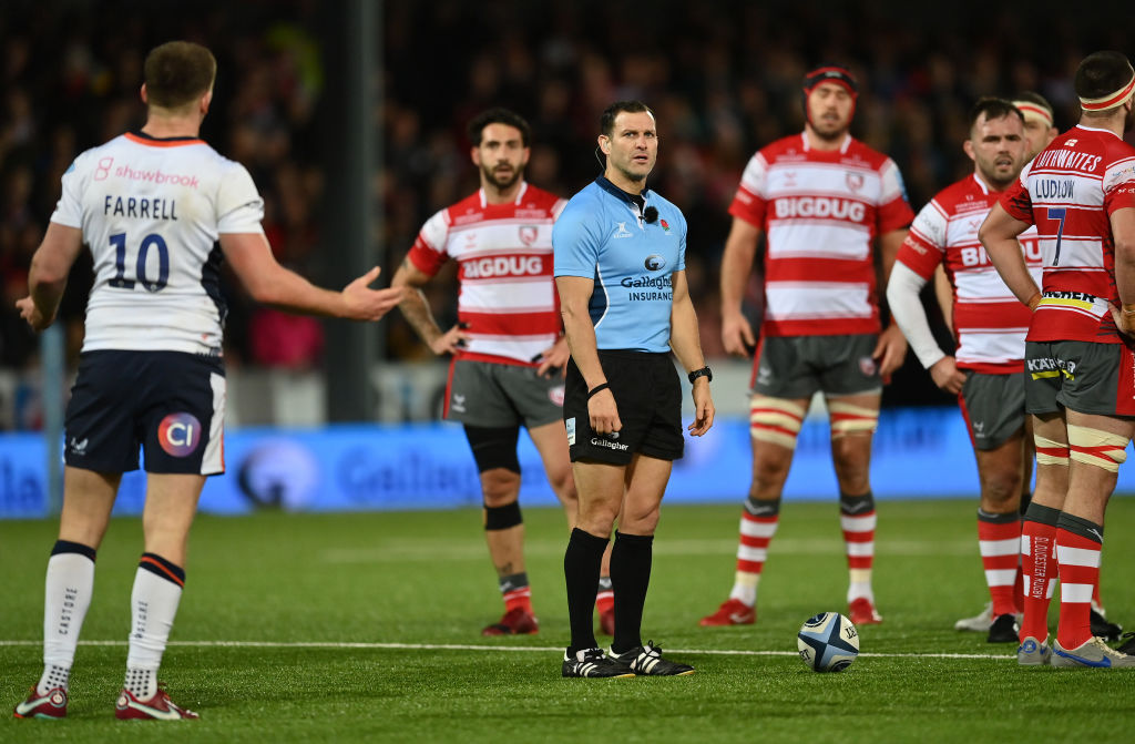 Rugby referee Karl Dickson and fly-half Owen Farrell