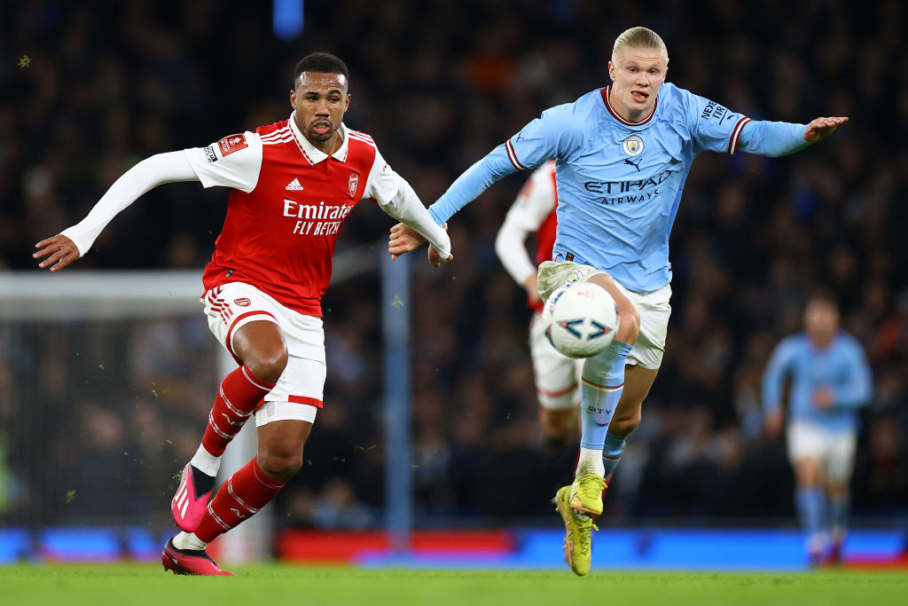 MANCHESTER, ENGLAND - JANUARY 27: Erling Haaland of Manchester City battle for possession with Gabriel Dos Santos of Arsenal during the Emirates FA Cup Fourth Round match between Manchester City and Arsenal at Etihad Stadium on January 27, 2023 in Manchester, England. (Photo by Michael Steele/Getty Images)