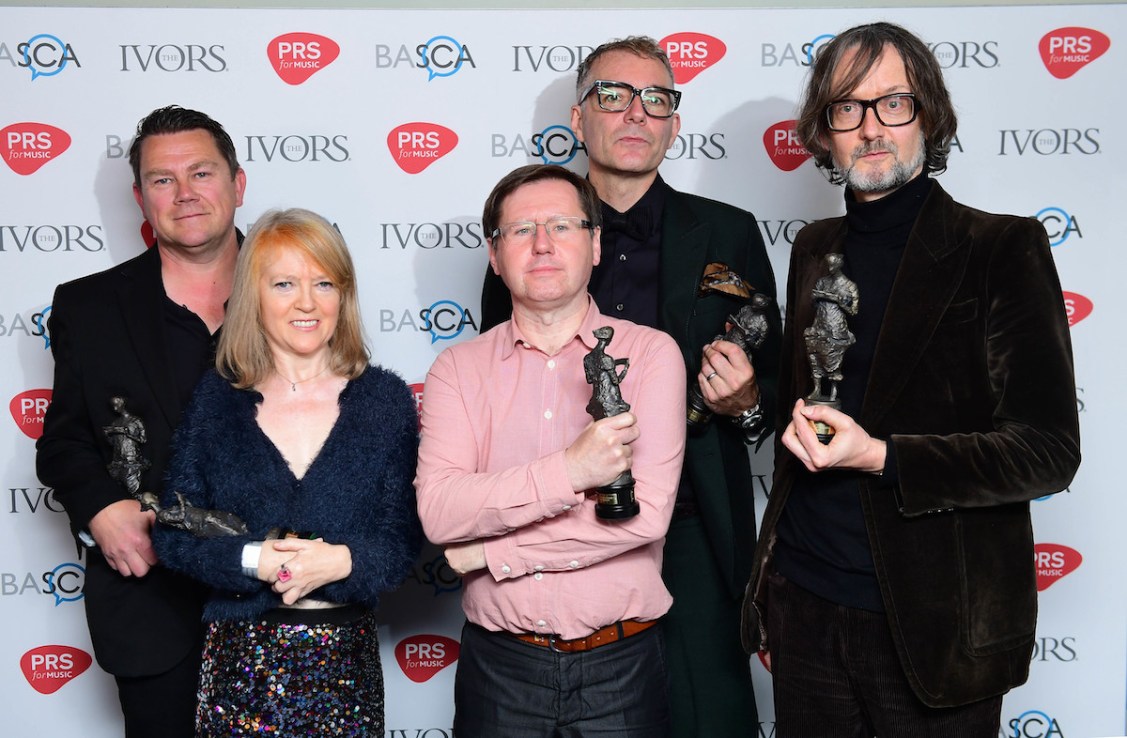(left to right) Nick Banks, Candida Doyle, Mark Webber, Steve Mackey and Jarvis Cocker of Pulp, with the award for Outstanding Song Collection during the 62nd Annual Ivor Novello Music Awards at Grosvenor House in London. Mackey, the bass guitarist of Britpop band Pulp, has died aged 56. Issue date: Thursday March 2, 2023.