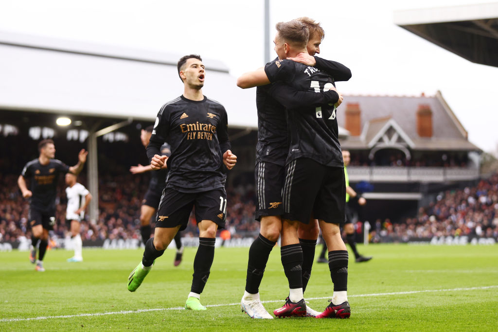 LONDON, ENGLAND - MARCH 12: Martin Odegaard of Arsenal celebrates after scoring the team's third goal with teammate Leandro Trossard during the Premier League match between Fulham FC and Arsenal FC at Craven Cottage on March 12, 2023 in London, England. (Photo by Clive Rose/Getty Images)