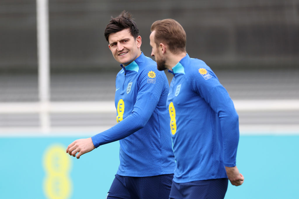 BURTON-UPON-TRENT, ENGLAND - MARCH 21: Harry Maguire and Harry Kane of England talk during a training session at St Georges Park on March 21, 2023 in Burton-upon-Trent, England. (Photo by Catherine Ivill/Getty Images)