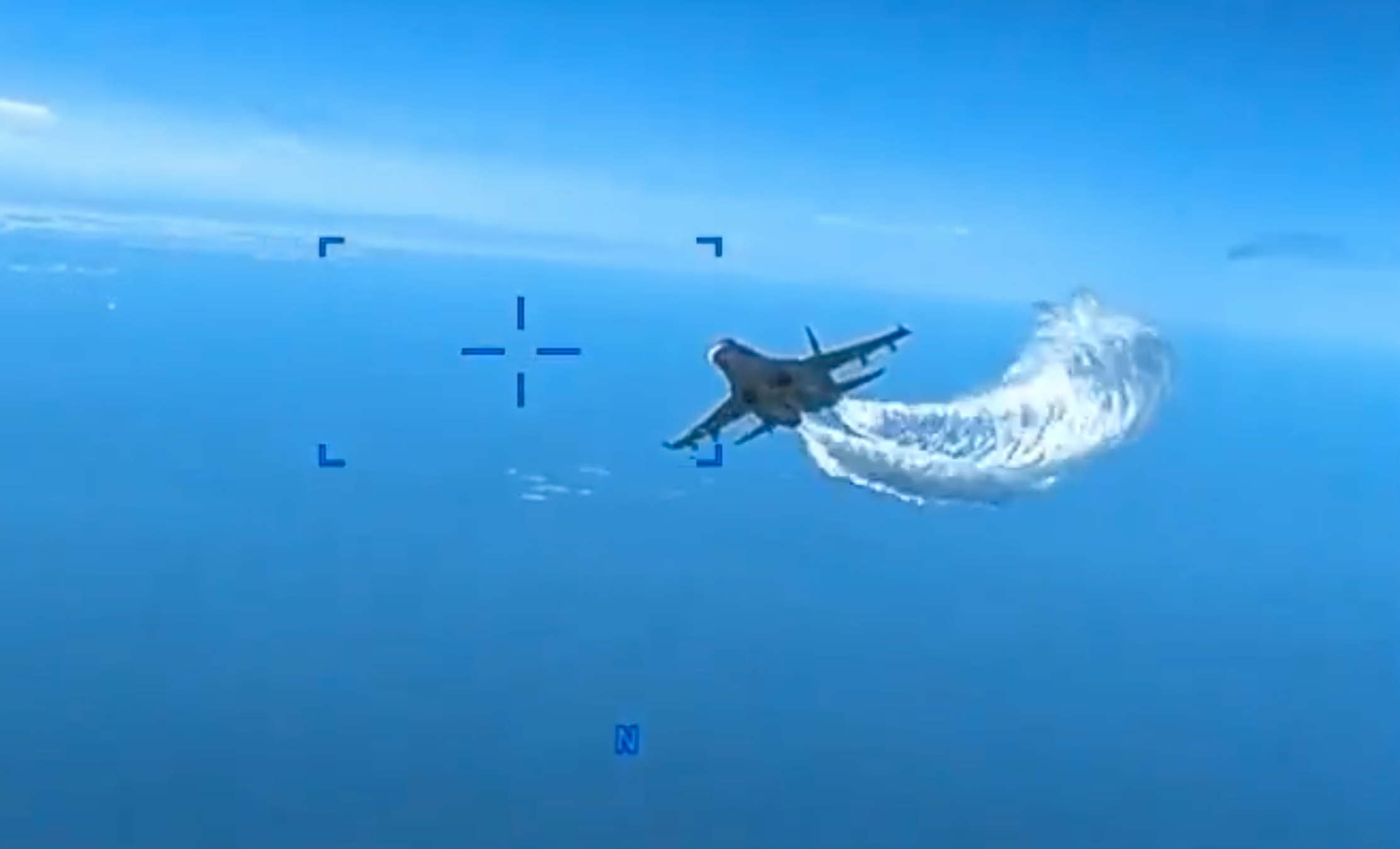 Watch the moment a Russia warplane dumps fuel on a US drone as fears of direct conflict