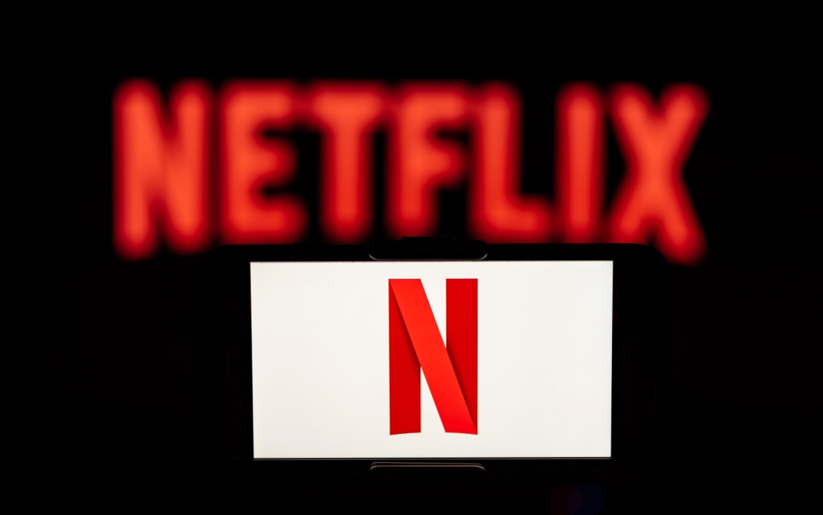Netflix logo is seen displayed on a mobile phone screen. (Photo Illustration by Idrees Abbas/SOPA Images/LightRocket via Getty Images)