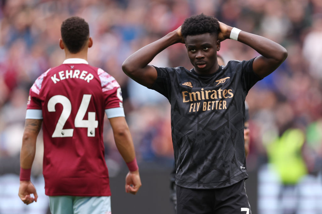 LONDON, ENGLAND - APRIL 16: Bukayo Saka of Arsenal reacts after missing a penalty during the Premier League match between West Ham United and Arsenal FC at London Stadium on April 16, 2023 in London, England. (Photo by Alex Pantling/Getty Images)