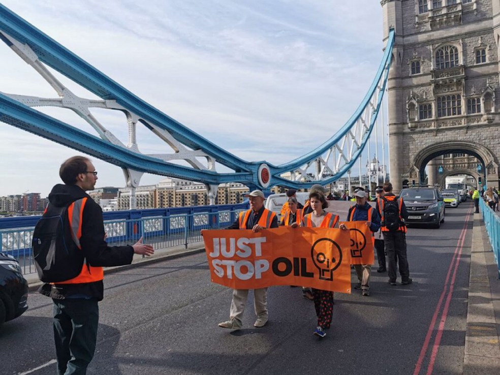 Handout photo issued by Just Stop Oil of their activists their slow walk protest in central London. Climate change protesters have again clashed with drivers as they staged marches on three bridges in central London. Forty-five Just Stop Oil activists blocked the roads on Blackfriars, London and Tower Bridges on Tuesday morning by walking slowly in the roadway. Issue date: Tuesday May 23, 2023. PA Photo. See PA story POLICE Oil. Photo credit: Just Stop Oil/PA Wire 