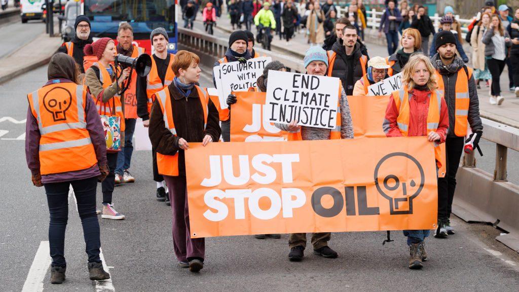 Just Stop Oil demonstrators stage a protest on Waterloo Bridge. (Photo by Belinda Jiao/Getty Images)