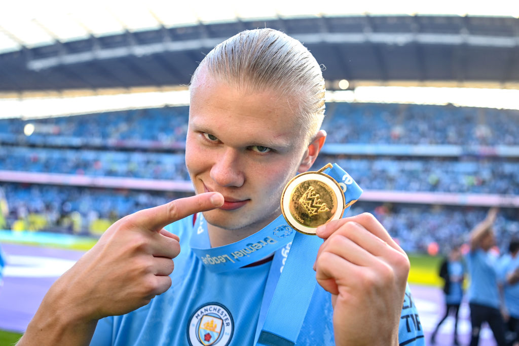 MANCHESTER, ENGLAND - MAY 21: Erling Haaland of Manchester City celebrates with his Premier League winners medal after the Premier League match between Manchester City and Chelsea FC at Etihad Stadium on May 21, 2023 in Manchester, England. (Photo by Michael Regan/Getty Images)
