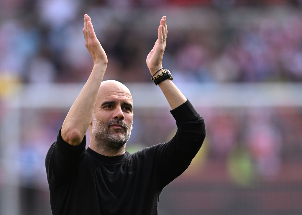 BRENTFORD, ENGLAND - MAY 28: Pep Guardiola, Manager of Manchester City, applauds fans after the Premier League match between Brentford FC and Manchester City at Gtech Community Stadium on May 28, 2023 in Brentford, England. (Photo by Mike Hewitt/Getty Images)
