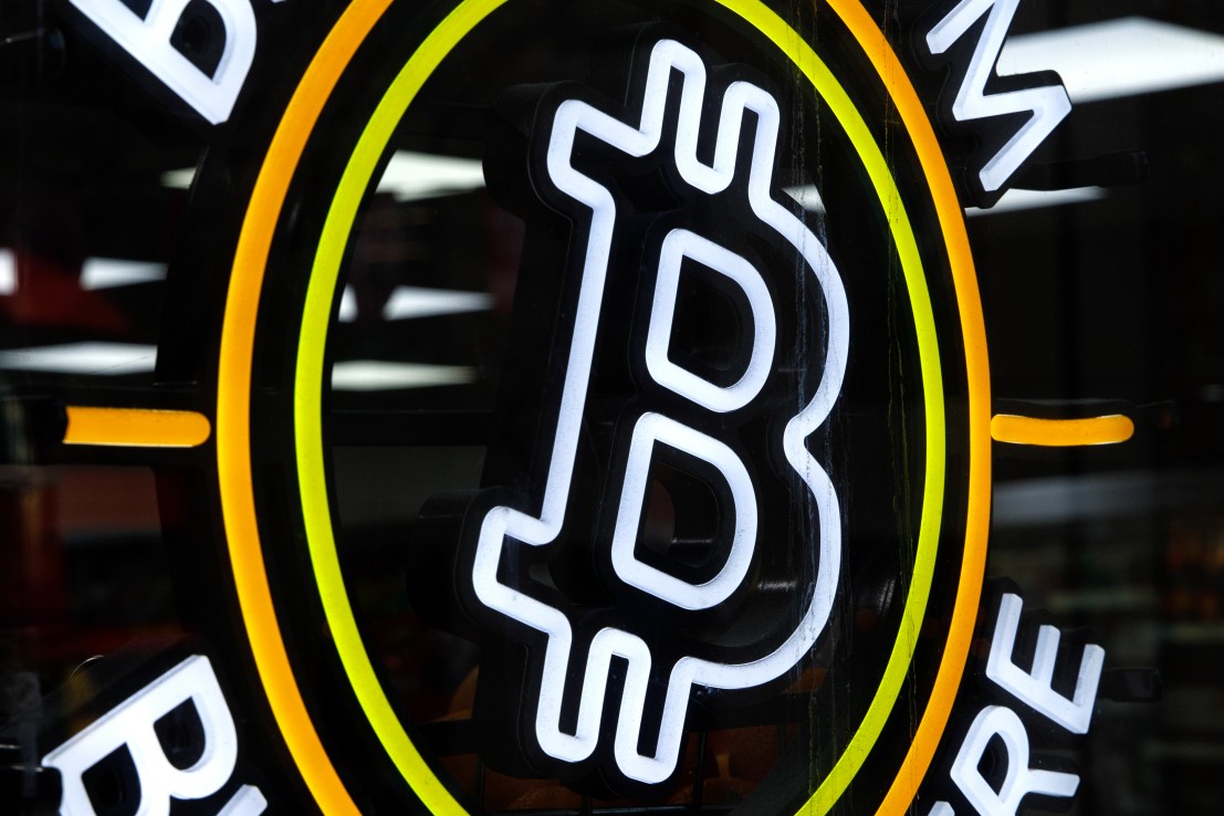 A neon sign advertising the availability of a bitcoin automated teller machine (ATM) at a Texaco petrol station in London, U.K., on Friday, Feb. 4, 2022. Getting to grips with crypto on your annual tax bill is already a tough nut to crack, but the U.K. tax authorities are about to make it even harder. Photographer: Luke MacGregor/Bloomberg via Getty Images
