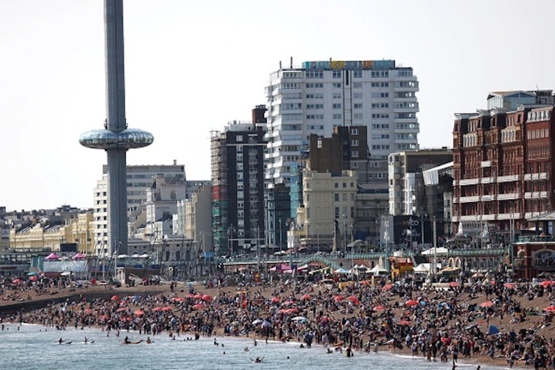  People enjoy the warm weather at Brighton beach on May 28, 2023 in Brighton, England. The UK is set to experience the hottest days of the year over the Bank Holiday weekend, with balmy temperatures expected into parts of next week. (Photo by Hollie Adams/Getty Images)