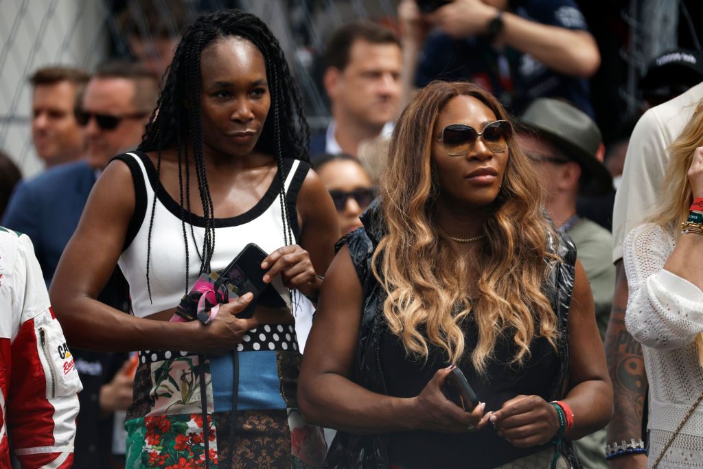 Serena and Venus Williams have bought the first of six teams in the golf league backed by Tiger Woods and Rory McIlroy.