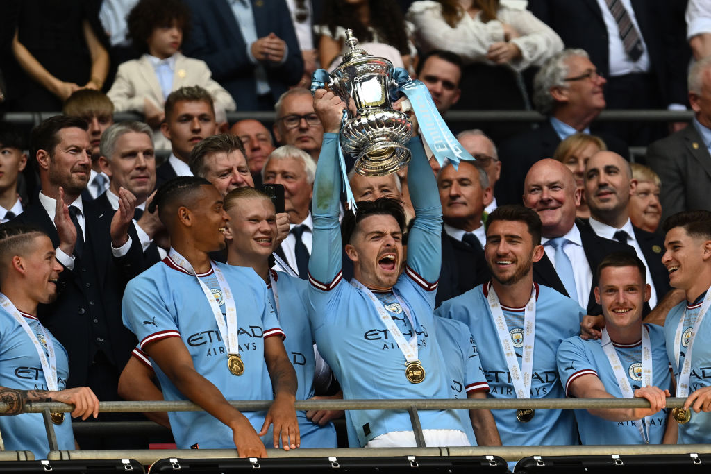 As the result of a match where a trophy was up for grabs turned Manchester blue yet again, City went within one win of an iconic treble – something English football has not seen since United’s feat in 1998-1999. So with their 2-1 FA Cup final win over United leaving Pep Guardiola’s side two thirds of the way on the road to history, how does their treble attempt stack up to United’s from 24 years ago. 