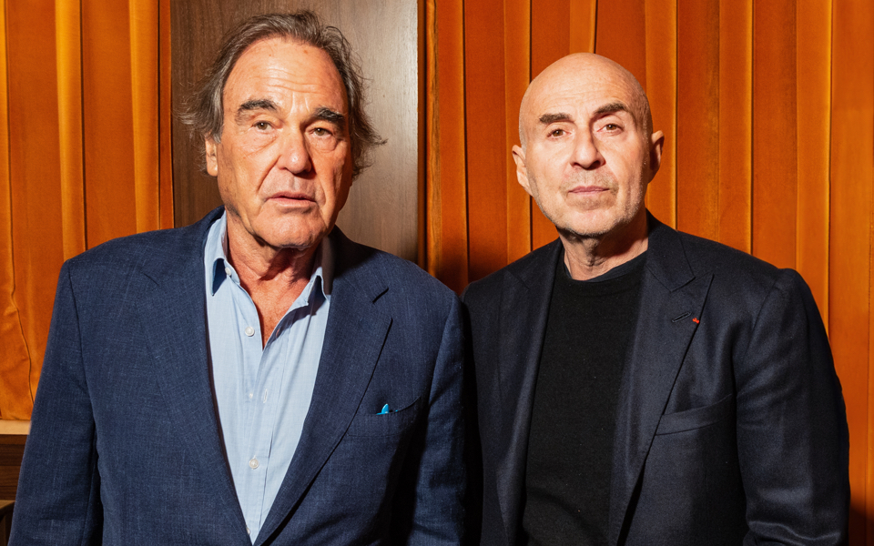 Oliver Stone with his producing partner Fernando Sulichin