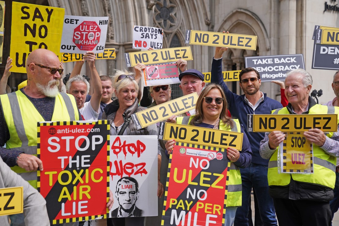 Demonstrators outside the High Court where five Conservative-led councils are challenging Mayor of London Sadiq Khan's intention to expand London's ultra low emission zone (Ulez). Photo: Lucy North/PA Wire