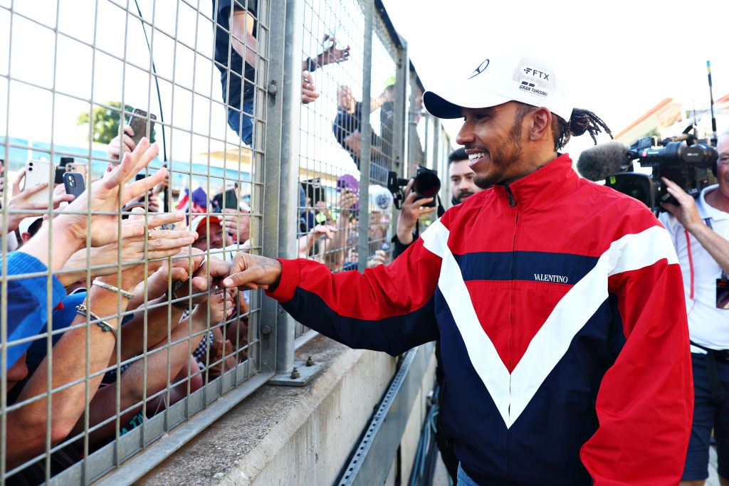 NORTHAMPTON, ENGLAND - JULY 03: Lewis Hamilton of Great Britain and Mercedes waves at fans following the F1 Grand Prix of Great Britain at Silverstone on July 03, 2022 in Northampton, England. (Photo by Clive Rose/Getty Images)
