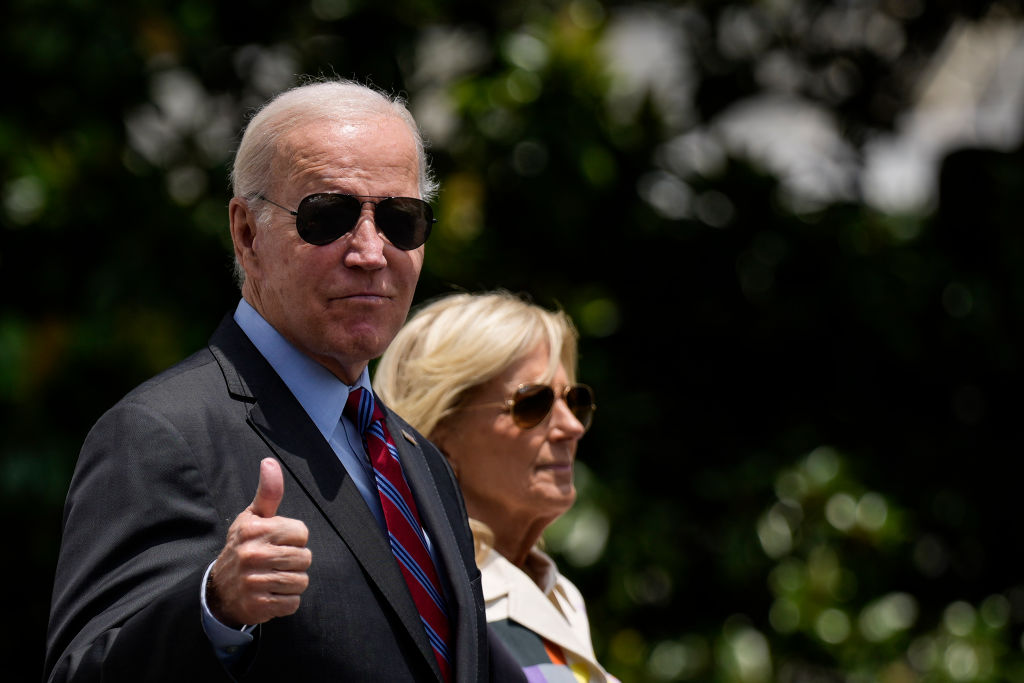 President Joe Biden gives a thumbs up as he walks with first lady Jill Biden to Marine One on the South Lawn of the White House (Photo by Drew Angerer/Getty Images)