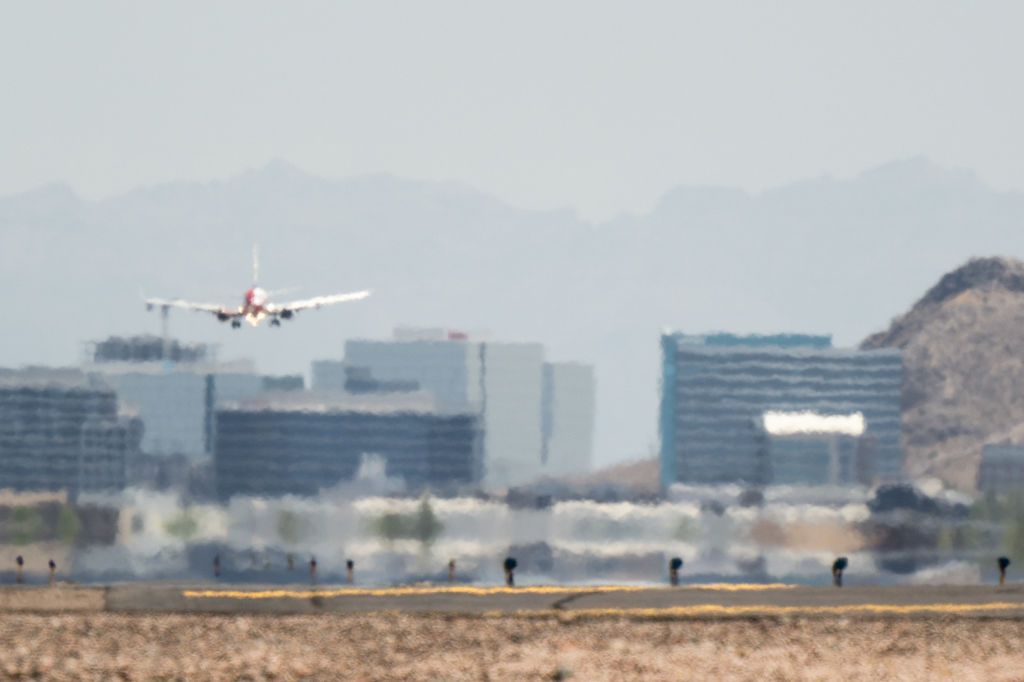 An airplane approaches the runway at the Phoenix Sky Harbor International Airport during a heat wave on July 15, 2023 in Phoenix, Arizona. (Photo by Brandon Bell/Getty Images)