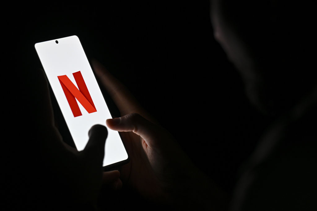 Netflix shares sink as company announces halt in reporting subscriber tally, weak outlook