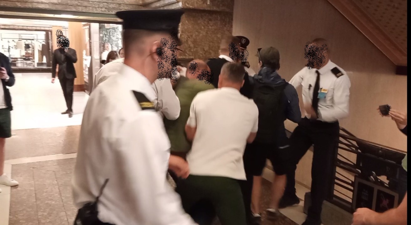 Screenshot from video shared by Just Stop Oil of private security removing them from Harrods 