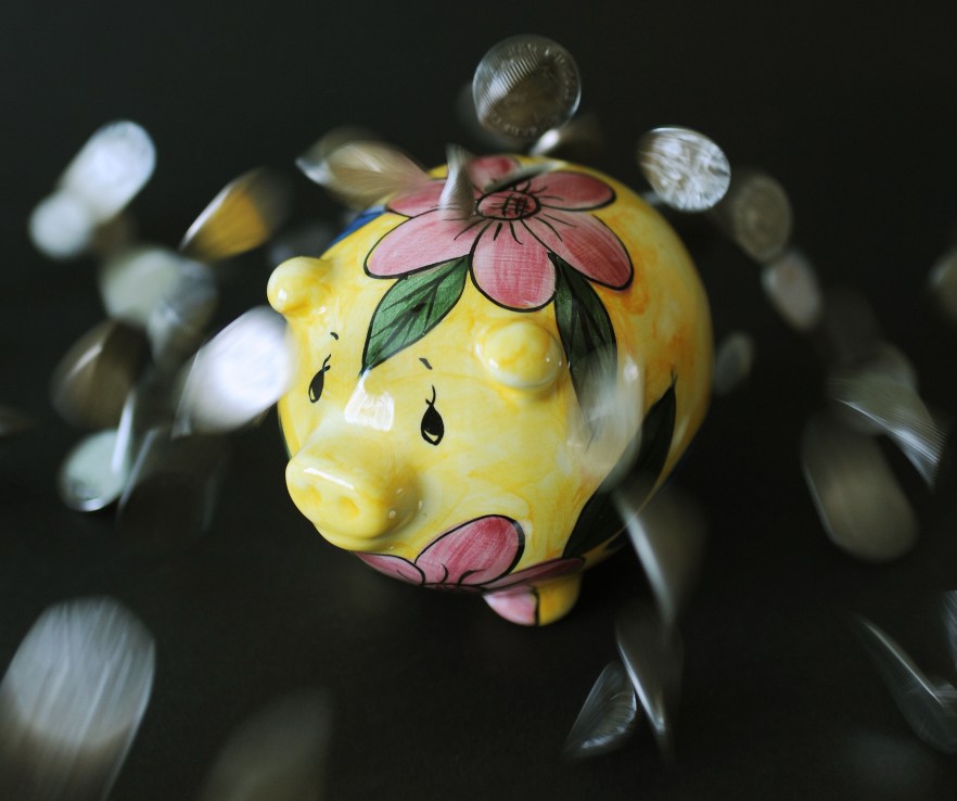 Coins dropped onto a piggy bank, as Premium Bonds odds will improve to the best level seen in more than 15 years (Photo credit should read: Nick Ansell/PA Wire)