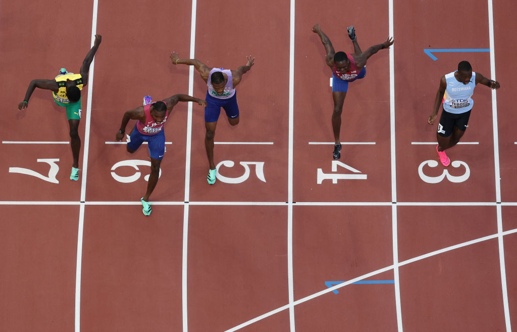 Hughes (centre) took bronze in a photo finish to the men's 100m