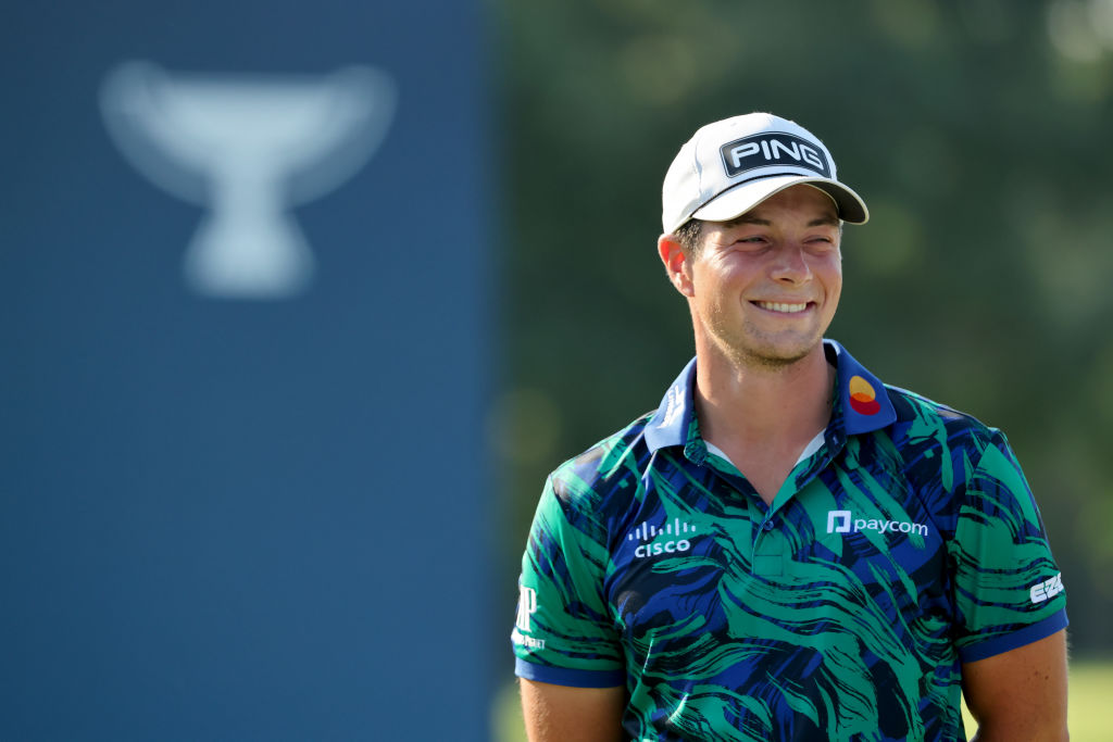 OLYMPIA FIELDS, ILLINOIS - AUGUST 20: Viktor Hovland of Norway celebrates during the trophy ceremony after winning the BMW Championship at Olympia Fields Country Club on August 20, 2023 in Olympia Fields, Illinois. (Photo by Stacy Revere/Getty Images)