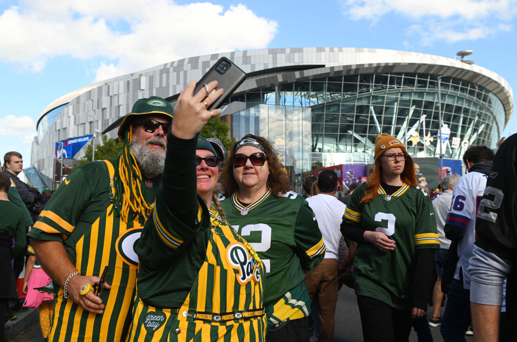LONDON, ENGLAND - OCTOBER 09: Green Bay Packers fans pose for a photo outside the stadium prior to the NFL match between New York Giants and Green Bay Packers at Tottenham Hotspur Stadium on October 09, 2022 in London, England. (Photo by Mike Hewitt/Getty Images)