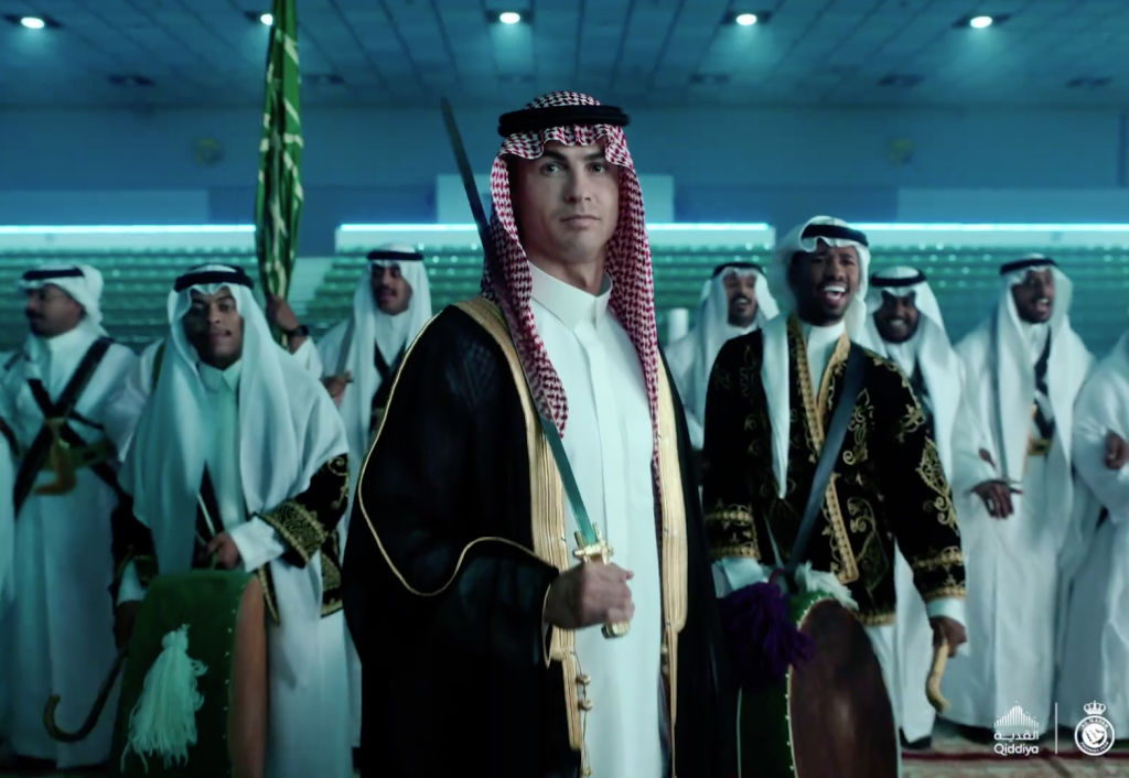 RIYADH, SAUDI ARABIA - SEPTEMBER 22: (----EDITORIAL USE ONLY - MANDATORY CREDIT - 'AL NASSR FOOTBALL CLUB / HANDOUT' - NO MARKETING NO ADVERTISING CAMPAIGNS - DISTRIBUTED AS A SERVICE TO CLIENTS----) A screen grab captured from the video shared by the Al Nassr FC shows Cristiano Ronaldo (C) of Al Nassr dressed in traditional Arabic clothes bisht and kufiyeh on the occasion of September 23 Saudi National Day, in Riyadh, Saudi Arabia on September 22, 2023. (Photo by Al Nassr FC / Handout/Anadolu Agency via Getty Images)