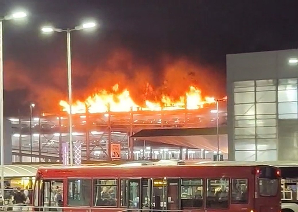 Screen grab taken with permission from video posted on Twitter by @Soriyn23of a fire at a car park at Luton Airport On Tuesday. All flights at the airport were suspended. Issue date: Wednesday October 11, 2023. Photo credit: @Soriyn23/PA Wire 
