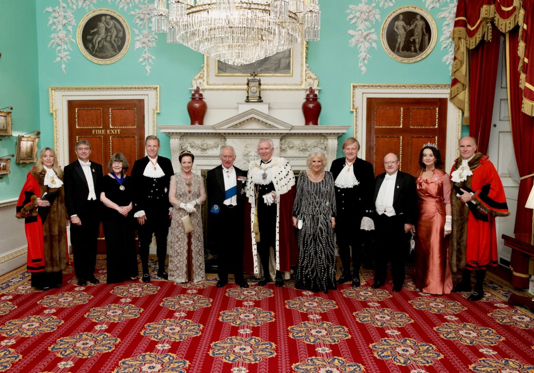 The Lord Mayor, Nicholas Lyons, flanked by the King and the Queen and with City dignitaries at Mansion House last night