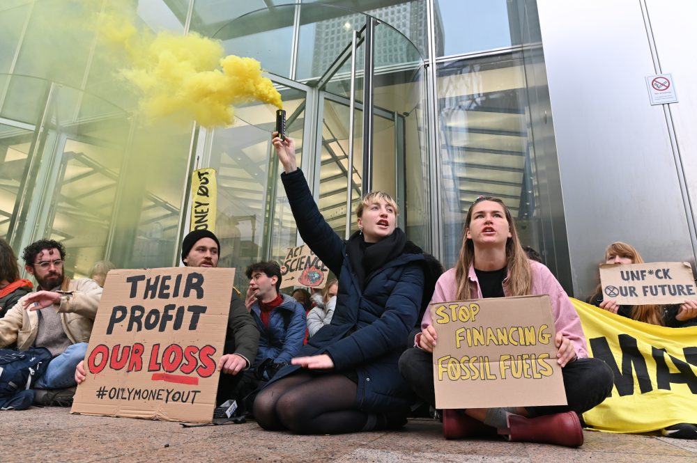 Climate activists were joined by Greta Thunberg in a protest outside banking and finance offices in Canary Wharf today.