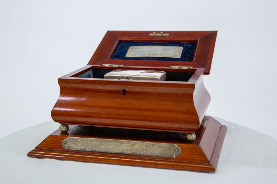 After the war, Fisher became secretary of the Queensland Football Federation and it was in this capacity that he donated the case to house the ashes of cigars smoked by the captains of Australia and New Zealand after a three-match series between them in 1923. Thus the Soccer Ashes were born.