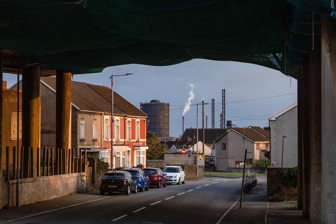 The steel works operated by Tata Steel Ltd. beyond residential houses in Port Talbot, UK, on Wednesday, Aug. 17, 2022. Europe's heavy industry is buckling under surging power costs which are hitting energy-intensive manufacturers the hardest. Photographer: Hollie Adams/Bloomberg via Getty Images