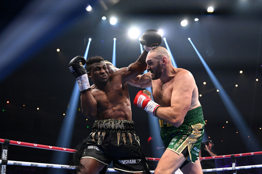 RIYADH, SAUDI ARABIA - OCTOBER 28: Francis Ngannou punches  Tyson Fury during the Heavyweight fight between Tyson Fury and Francis Ngannou at Boulevard Hall on October 28, 2023 in Riyadh, Saudi Arabia. (Photo by Justin Setterfield/Getty Images)