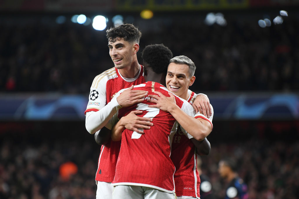 LONDON, ENGLAND - NOVEMBER 08: Leandro Trossard of Arsenal celebrates with teammates Bukayo Saka and Kai Havertz after scoring the team's first goal during the UEFA Champions League match between Arsenal FC and Sevilla FC at Emirates Stadium on November 08, 2023 in London, England. (Photo by Stuart MacFarlane/Arsenal FC via Getty Images)