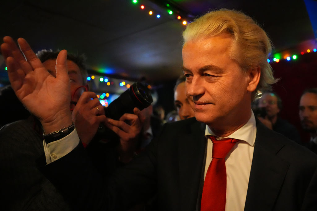  Geert Wilders (C), Dutch right-wing politician and leader of the Party for Freedom (PVV), reacts to the exit poll and early results that strongly indicate a victory for his party in the Dutch elections on November 22, 2023 in Scheveningen, Netherlands. Dutch voters have gone to the polls today in one of the most tightly contested general elections in recent years. (Photo by Carl Court/Getty Images).