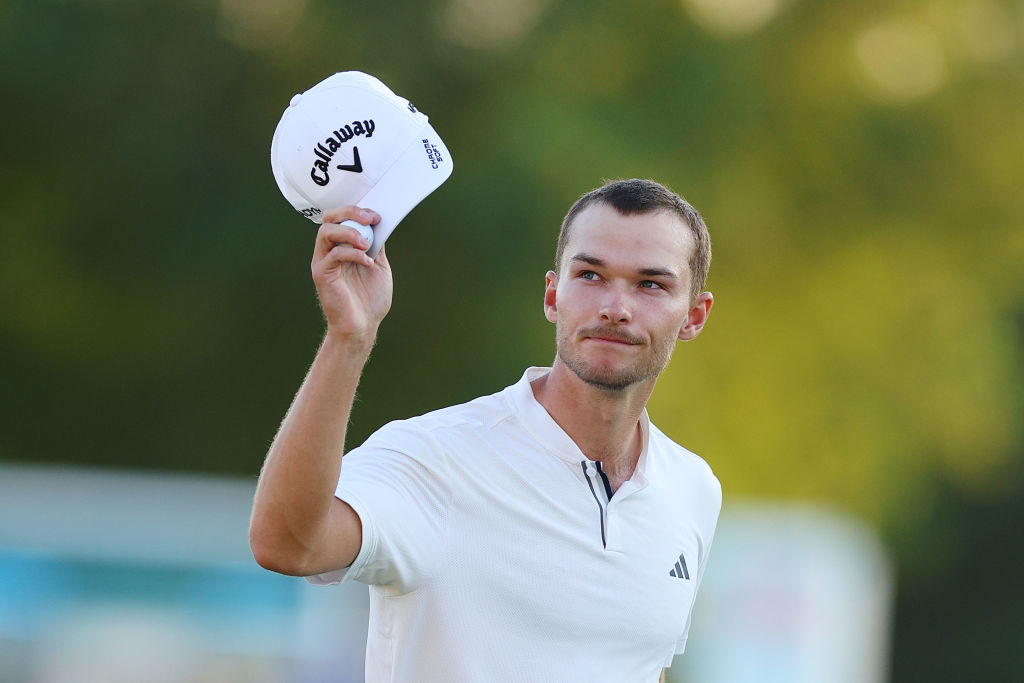 DUBAI, UNITED ARAB EMIRATES - NOVEMBER 17: Nicolai Hojgaard of Denmark acknowledges the crowd on the 18th green during Day Two of the DP World Tour Championship on the Earth Course at Jumeirah Golf Estates on November 17, 2023 in Dubai, United Arab Emirates. (Photo by Andrew Redington/Getty Images)