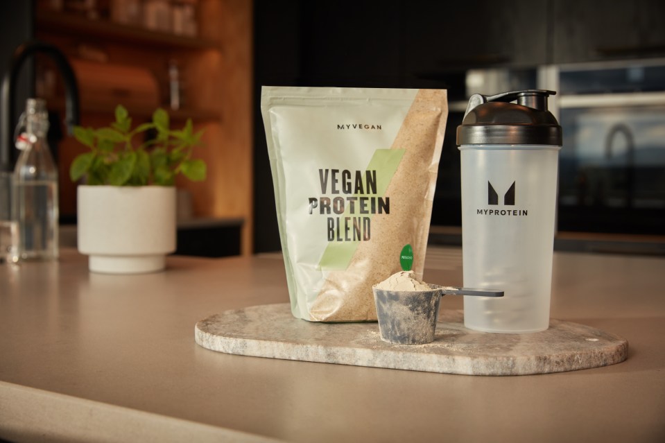 A picture of Myprotein’s Vegan Protein Blend and branded water bottle.
