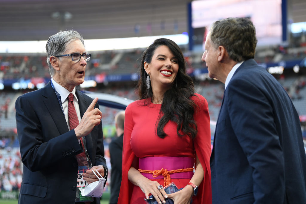 PARIS, FRANCE - MAY 28: Owners of Liverpool, John W. Henry, wife Linda Pizzuti Henry and Tom Werner interact prior to the UEFA Champions League final match between Liverpool FC and Real Madrid at Stade de France on May 28, 2022 in Paris, France. (Photo by Michael Regan - UEFA/UEFA via Getty Images)