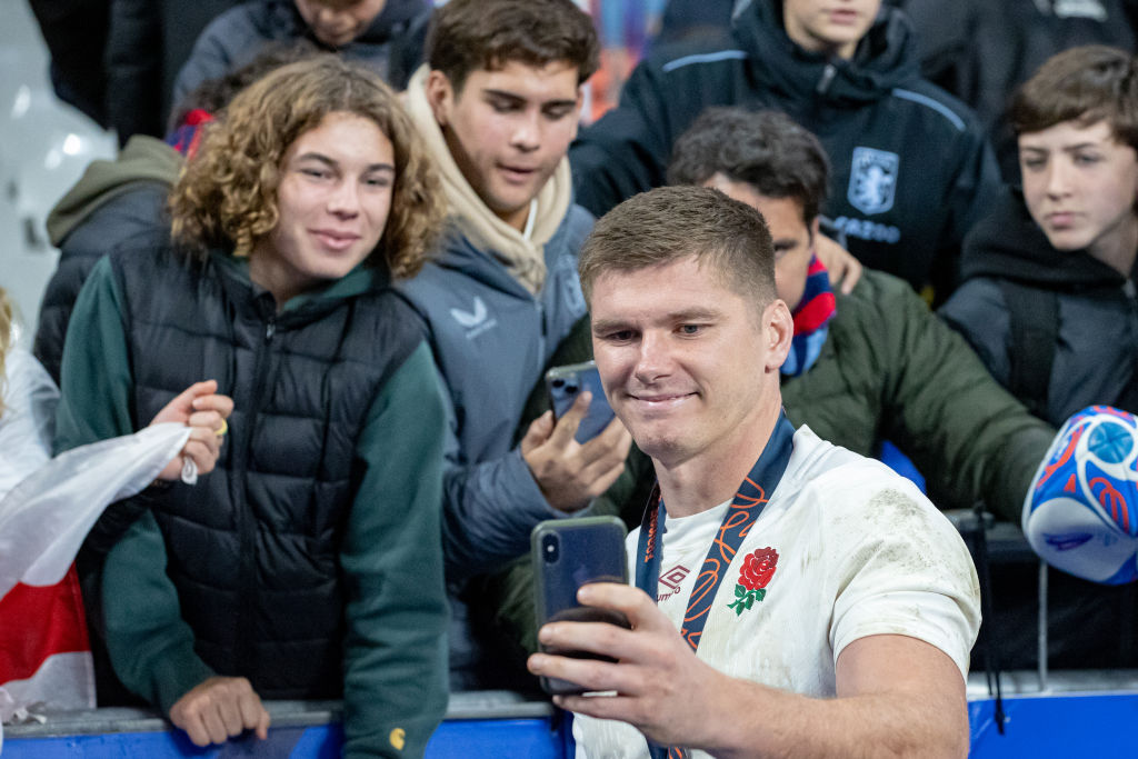 PARIS, FRANCE - OCTOBER 27: Owen Farrell of England takes a selfie with fans after the victory during the Rugby World Cup France 2023 Bronze Final match between Argentina and England at Stade de France on October 27, 2023 in Paris, France. (Photo by RvS.Media/Sylvie Failletaz/Getty Images)