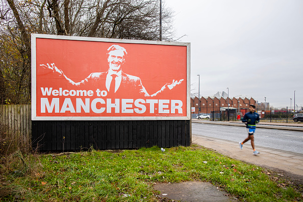 MANCHESTER, ENGLAND - DECEMBER 3: A billboard outside Manchester United's Old Trafford stadium shows prospective Manchester United stakeholder Sir Jim Ratcliffe alongside the slogan 'Welcome To Manchester' ahead of  the Premier League match between Manchester City and Tottenham Hotspur at Etihad Stadium on December 3, 2023 in Manchester, England. In 2009, Manchester City famously displayed a billboard announcing the signing of Carlos Tevez from their close rivals with a similar design and slogan. (Photo by Simon Stacpoole/Offside/Offside via Getty Images)